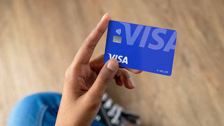 person-holding-card-in-hand-800x