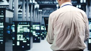 Repairman running code in data center